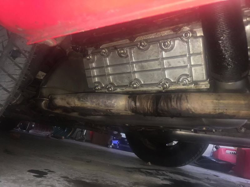The old valve cover with the very obvious oil leak on the heat exchangers